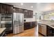 Gourmet kitchen with stainless steel appliances, including double oven and refrigerator at 5475 Shoshone Dr, Longmont, CO 80504