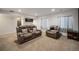 Relaxing living room features leather recliners, recessed lighting, and a convenient wet bar for entertaining at 5475 Shoshone Dr, Longmont, CO 80504