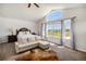 Bright main bedroom boasting vaulted ceilings, large windows with views, and a comfortable sitting area at 5475 Shoshone Dr, Longmont, CO 80504