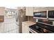 Updated kitchen with stainless appliances, granite counters, and access to dining area at 2896 W 119Th Ave, Westminster, CO 80234