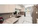 Well-appointed kitchen features granite countertops and stainless steel appliances overlooking dining area at 2896 W 119Th Ave, Westminster, CO 80234