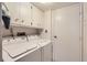Clean laundry room with lots of storage and machines at 2896 W 119Th Ave, Westminster, CO 80234
