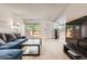 Bright living room offers a comfortable sectional sofa, adjacent to the front door and television at 2896 W 119Th Ave, Westminster, CO 80234