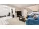 Spacious living room with a plush blue sofa and an open layout, perfect for entertaining at 2896 W 119Th Ave, Westminster, CO 80234