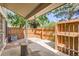 Secluded patio with wooden fencing, overhead cover, and a charming hanging flower basket at 2896 W 119Th Ave, Westminster, CO 80234