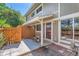 Inviting patio featuring wooden fencing, hanging flower baskets, and easy access to the home's entrance at 2896 W 119Th Ave, Westminster, CO 80234