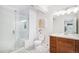 The bathroom includes glass enclosed shower, updated tile flooring, vanity, and modern fixtures at 7033 E Lake Cir, Centennial, CO 80111