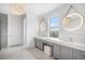 Bright bathroom features double vanity, white quartz countertop, shiplap wall and lighted round mirrors at 7033 E Lake Cir, Centennial, CO 80111