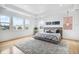 Bright main bedroom with large windows, tray ceilings, and hardwood flooring at 7033 E Lake Cir, Centennial, CO 80111