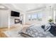 Comfortable bedroom features a fireplace and a luxurious king-size bed with side tables at 7033 E Lake Cir, Centennial, CO 80111