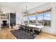 Inviting dining area features a large table, bench seating, and lots of natural light at 7033 E Lake Cir, Centennial, CO 80111