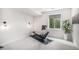 Bright exercise room boasts natural light, neutral walls, and space for a Hydrow workout machine at 7033 E Lake Cir, Centennial, CO 80111