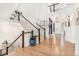 Spacious foyer with a staircase, hardwood floors, and plenty of natural light at 7033 E Lake Cir, Centennial, CO 80111