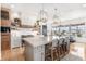 Spacious kitchen with a large island, modern pendant lighting, and stainless steel appliances at 7033 E Lake Cir, Centennial, CO 80111
