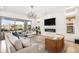 Bright living room boasts a fireplace, chandelier, and sliding doors to a patio at 7033 E Lake Cir, Centennial, CO 80111