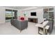 Finished basement living room with sliding glass doors and two cozy sofas at 7033 E Lake Cir, Centennial, CO 80111