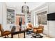 Inviting home office with custom shelves, vintage desk, and great natural light at 7033 E Lake Cir, Centennial, CO 80111