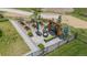 An aerial view of a stunning patio featuring a fire pit, garden, landscaping and elegant furniture at 7033 E Lake Cir, Centennial, CO 80111