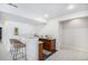 Features a stylish bar area complete with granite countertops, sink, and wicker seating at 7033 E Lake Cir, Centennial, CO 80111