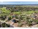 Scenic aerial view of a home nestled within a lush, green landscape with golf course at 7778 Windwood Way, Parker, CO 80134