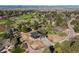 Stunning aerial view of the modern home and surrounding golf course neighborhood at 7778 Windwood Way, Parker, CO 80134