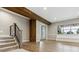 Basement area with wood beams and columns, lots of natural light, and wood floor at 7778 Windwood Way, Parker, CO 80134