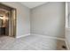 Bedroom features plush neutral carpeting, white baseboards, and an ensuite bath at 7778 Windwood Way, Parker, CO 80134