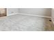 Spacious bedroom features plush neutral carpeting, white baseboards, and neutral paint at 7778 Windwood Way, Parker, CO 80134