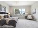 Serene bedroom with plush carpeting, a large window, and stylish decor at 7778 Windwood Way, Parker, CO 80134