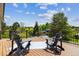 Relaxing deck area with comfortable seating and scenic views of the golf course at 7778 Windwood Way, Parker, CO 80134