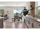 Inviting dining area with large windows, a dining table, and outdoor views at 7778 Windwood Way, Parker, CO 80134