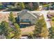 Beautiful modern home featuring large windows, a deck, professional landscaping and mature trees at 7778 Windwood Way, Parker, CO 80134
