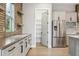 Bright kitchen showcases modern cabinets, a stainless steel refrigerator, and a walk-in pantry at 7778 Windwood Way, Parker, CO 80134