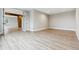 Bright, open living room with modern flooring and neutral walls at 7778 Windwood Way, Parker, CO 80134