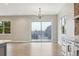 Bright, open living room features hardwood floors, large sliding doors, and modern lighting at 7778 Windwood Way, Parker, CO 80134
