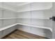 Well-organized pantry with adjustable shelving for optimal storage and hardwood floors at 7778 Windwood Way, Parker, CO 80134