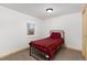 Cozy bedroom with natural light and a classic bed frame at 109 S Fulton Ave, Fort Lupton, CO 80621