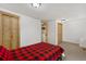 Compact bedroom with access to closet space and laundry area at 109 S Fulton Ave, Fort Lupton, CO 80621