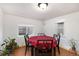 Bright dining room with wood floors and a window offering natural light at 109 S Fulton Ave, Fort Lupton, CO 80621