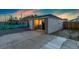 Inviting exterior view of a home with a well-lit entrance, showcasing modern siding and a spacious driveway at 109 S Fulton Ave, Fort Lupton, CO 80621