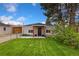 Inviting single-story home featuring a well-maintained lawn and charming facade at 109 S Fulton Ave, Fort Lupton, CO 80621