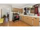 Functional kitchen featuring ample cabinet space and stainless steel appliances at 109 S Fulton Ave, Fort Lupton, CO 80621