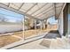 A covered back patio with patterned concrete and string lights overlooks the backyard at 6880 W Airview Ave, Lakewood, CO 80232