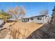 Large backyard, with a grey fence, and minimal grass at 6880 W Airview Ave, Lakewood, CO 80232