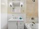 Bathroom with a tub shower and tiled walls at 6880 W Airview Ave, Lakewood, CO 80232