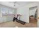 Brightly lit room with a treadmill and stationary bicycle at 6880 W Airview Ave, Lakewood, CO 80232