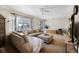 Spacious living room with a sectional sofa, large window, and plenty of room for entertaining guests at 6880 W Airview Ave, Lakewood, CO 80232