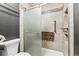 Bathroom features a shower with built-in seat and grab bars at 2670 E Otero Pl # 11, Centennial, CO 80122