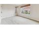 Bright bedroom boasts neutral walls and carpet, large windows, and woven shades at 2670 E Otero Pl # 11, Centennial, CO 80122