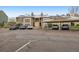 View of condo complex with parking area and covered parking at 2670 E Otero Pl # 11, Centennial, CO 80122